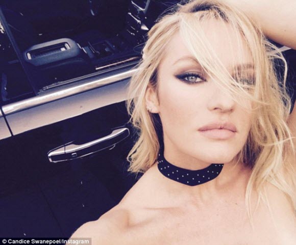 Model Candice Swanepoel goes topless on a white horse in latest provocative Instagram post